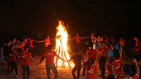 Wonderful dancing around big fire in the forest