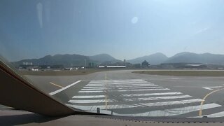 What do we see as we taxi to the gate in Hong Kong in a B747-400 freighter