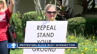 Protesters block intersection