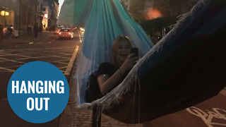 Revellers use two traffic lights to build makeshift HAMMOCK