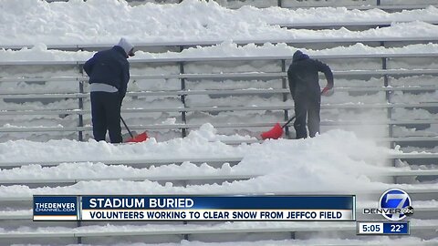 Volunteers help clear snow from Jeffco football stadium ahead of big weekend games
