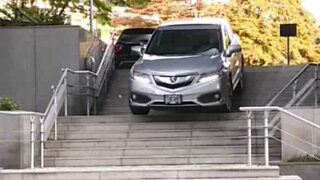 Driver takes shortcut down flight of stairs