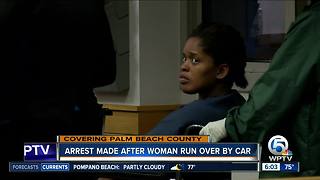 Arrest made after woman run over by car
