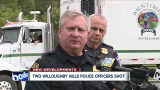2 officers, suspect shot at dealership