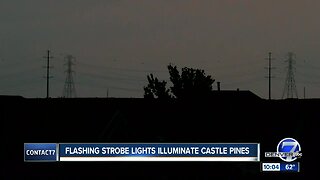 Flashing strobe lights atop new power line towers illuminate parts of Castle Pines