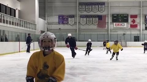 Young Boy In Hockey Gear Glides Right Into The Rink's Glass