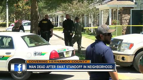 SWAT team finds man dead in apartment after he barricaded himself for hours