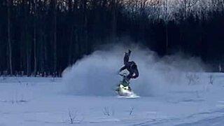 Guy catapulted from his snow mobile!