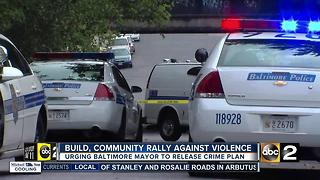 Organization rallies with community against crime, urges Pugh for crime plan