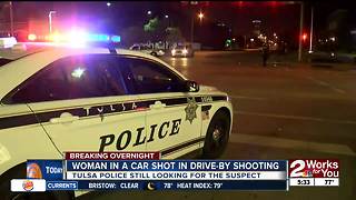 Woman shot in car during drive-by shooting