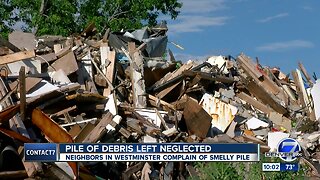 Burdened by fire-gutted eyesore for 10 months, Westbury tenants now coping with moldy debris pile