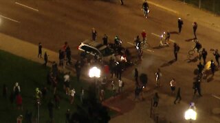 Full video: Man detained after running protester over with his car, police say