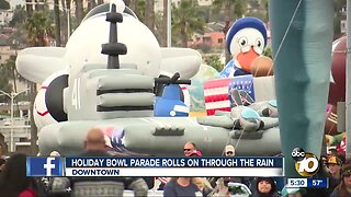 Holiday Bowl Parade rolls on through the rain