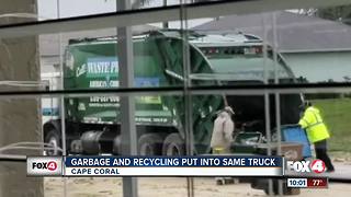 Workers seen putting garbage and recycling into same truck