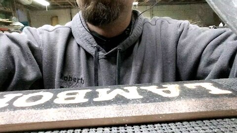 Carving a wood sign