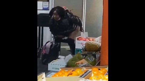 Black woman takes a crap in the middle of a grocery store