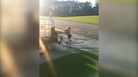 Cute Kid Who Is Too Small To Use The Pressure Washer