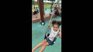 Smiling on the swing