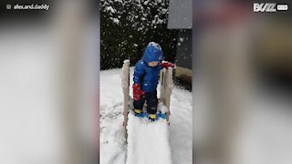 Toddler tumbles from snow covered slide