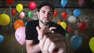 Man covers pop song using helium balloons