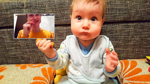 Cute baby eating a carrot with daddy