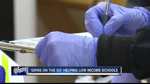 'Grins on the Go' cleaning teeth at low-income schools