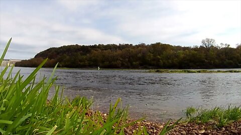 A man fly fishing a river to a Vivaldi Concerto....