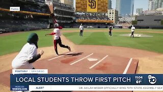 Local students throw first pitch
