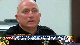 Deputy stops woman from jumping off bridge