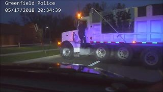DASHCAM VIDEO: Police help stop a moving dump truck, driver found unresponsive