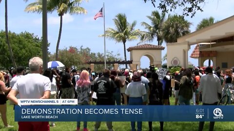 Group of protesters gather in Lake Worth Beach, 2 people attempt to burn American flag