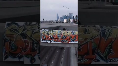 PUTTING A GRAFFITI BANNER ON A HIGHWAY 😨 #graffiti #graffitiart #shorts