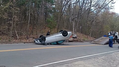 Boston and state police respond to a car rollover on Turtle Pond Parkway