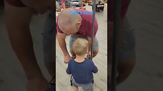 Father and son playing in the grocery store