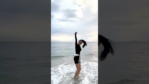 Chinese Girl On The Beach Dances Into Your Arms