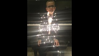 Gifted child plays Hark The Herald Angels Sing