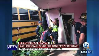 Vehicle crash sends school bus into Fort Pierce home.