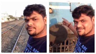 Guy gets smashed by a train while taking a selfie