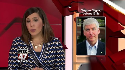 Gov. Rick Snyder signs and vetoes a flurry of bills