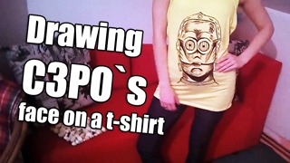 Drawing C3PO`s face on a t-shirt