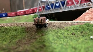 N Scale farm truck waiting at a crossing