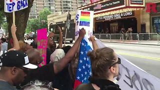 Protesters chant at today’s Donald Trump rally at the Fox Theatre in Atlanta, Georgia