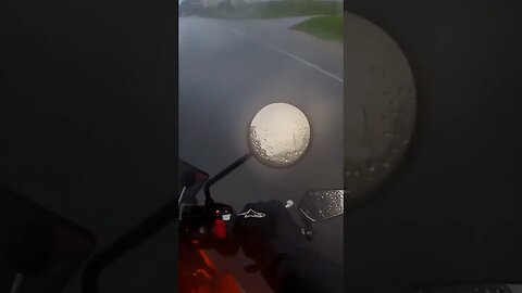 Riding motorcycle caught in flash flood. heavy rain.