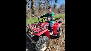 CHAINING UP THE FOUR-WHEELER TO HAUL AWAY FALLEN TREE LIMBS