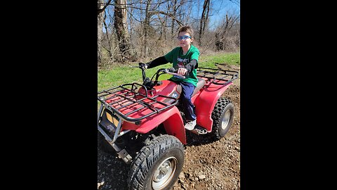 CHAINING UP THE FOUR-WHEELER TO HAUL AWAY FALLEN TREE LIMBS