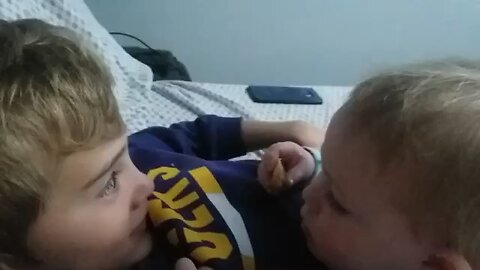 Baby talking to cousin for the first time