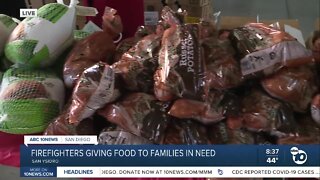 San Diego firefighters give out holiday meals to more than 300 families