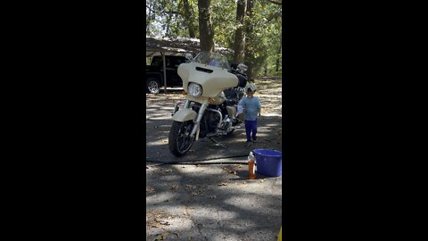 Max washes the Harley Street Glide