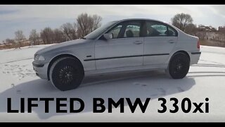 BMW 330xi custom lift build and big snow tires.