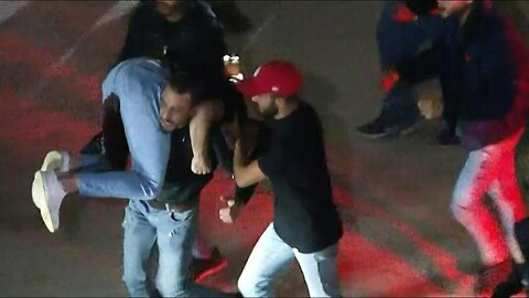 Palestinians retrieve a man wounded by Israeli fire outside Ofer prison